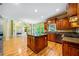 Open concept layout combining a kitchen island with views of the living room with fireplace and large windows at 205 Camden Creek Ct, Lawrenceville, GA 30043