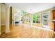 Spacious living room with fireplace, hardwood floors, and plenty of natural light from large windows at 205 Camden Creek Ct, Lawrenceville, GA 30043