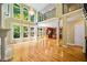 Bright living room featuring soaring ceilings, fireplace, large windows and hardwood floors at 205 Camden Creek Ct, Lawrenceville, GA 30043
