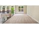 Upstairs loft area with neutral carpet, railing and natural light at 205 Camden Creek Ct, Lawrenceville, GA 30043