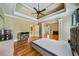 Spacious bedroom with hardwood floors leading to the fireplace and sitting area at 205 Camden Creek Ct, Lawrenceville, GA 30043
