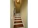 Interior staircase features wood treads and black metal balusters at 205 Camden Creek Ct, Lawrenceville, GA 30043