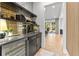 Stylish bar area with mirrored backsplash and built-in wine refrigerator at 2297 Nesbitt Ne Dr, Brookhaven, GA 30319