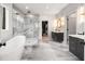 Luxurious bathroom with a free-standing tub, glass-enclosed shower and dual vanities at 2297 Nesbitt Ne Dr, Brookhaven, GA 30319
