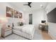 Bright and inviting bedroom with a large bed, desk, and artistic wall decor at 2297 Nesbitt Ne Dr, Brookhaven, GA 30319