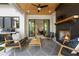 Back patio features a fireplace, patio furniture, outdoor kitchen area with a grill and sliding doors to interior at 2297 Nesbitt Ne Dr, Brookhaven, GA 30319