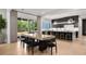 Dining area with modern lighting and flows to the kitchen area at 2297 Nesbitt Ne Dr, Brookhaven, GA 30319