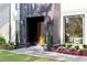 Close up of the elegant front entrance with black trim, well-maintained landscaping, and a inviting walkway at 2297 Nesbitt Ne Dr, Brookhaven, GA 30319