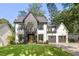 Charming two-story modern farmhouse with a well-manicured lawn and a three-car garage at 2297 Nesbitt Ne Dr, Brookhaven, GA 30319