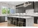 Modern kitchen featuring a large island with marble countertops and designer lighting at 2297 Nesbitt Ne Dr, Brookhaven, GA 30319