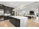 Open kitchen and living area with modern decor, marble countertops, and ample space at 2297 Nesbitt Ne Dr, Brookhaven, GA 30319