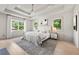 Bright main bedroom with tray ceiling, large windows, and hardwood floors at 2297 Nesbitt Ne Dr, Brookhaven, GA 30319