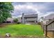 Wide backyard featuring a lush green lawn and privacy fence at 4271 Brighton Nw Way, Kennesaw, GA 30144