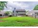 Fenced backyard featuring a well-maintained lawn and patio area at 4271 Brighton Nw Way, Kennesaw, GA 30144