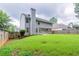 Large backyard featuring a lush lawn and fenced perimeter for privacy at 4271 Brighton Nw Way, Kennesaw, GA 30144