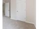 Bedroom with neutral walls and carpet, showcasing two white paneled doors at 4271 Brighton Nw Way, Kennesaw, GA 30144
