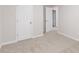 Neutral carpeted bedroom featuring two paneled doors at 4271 Brighton Nw Way, Kennesaw, GA 30144