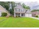 Inviting two-story home with landscaped front yard and double garage in a residential neighborhood at 4271 Brighton Nw Way, Kennesaw, GA 30144