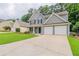 Beautiful two-story house featuring a well-kept lawn, a two-car garage and a charming front entrance at 4271 Brighton Nw Way, Kennesaw, GA 30144