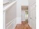 Bright hallway featuring hardwood floors, white trim, and access to multiple rooms at 4271 Brighton Nw Way, Kennesaw, GA 30144