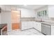 Bright kitchen featuring stainless steel appliances, white cabinets, and marble floors at 4271 Brighton Nw Way, Kennesaw, GA 30144