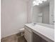 Bathroom with a white vanity, toilet, and a mirror, showcasing the shower and tub combo at 437 Autrey Dr, Douglasville, GA 30134