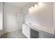 Bathroom with a sleek vanity, ample counter space, and stylish lighting fixtures at 437 Autrey Dr, Douglasville, GA 30134