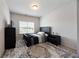 Neutral bedroom with a black bed frame and matching furnishings, offering a cozy space at 437 Autrey Dr, Douglasville, GA 30134