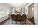 Beautiful dining area featuring stylish lighting, a large window, and views of the kitchen at 437 Autrey Dr, Douglasville, GA 30134