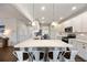 Bright kitchen featuring white cabinets, a large island, and stainless steel appliances at 437 Autrey Dr, Douglasville, GA 30134
