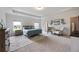 Spacious main bedroom with tray ceiling, plush carpet, and sitting area at 437 Autrey Dr, Douglasville, GA 30134