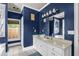 Elegant bathroom features a large vanity, great lighting and a decorative mirror at 4594 Poplar Rd, Pine Lake, GA 30072