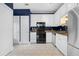 Modern kitchen with white cabinets, stainless steel appliances, and granite countertops at 4594 Poplar Rd, Pine Lake, GA 30072