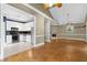 Spacious living room adjoining the kitchen with hardwood floors and abundant natural light at 4594 Poplar Rd, Pine Lake, GA 30072