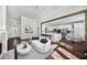 Open-concept living area with fireplace, seamless flow to kitchen, and lots of natural light at 7025 Bavarian Wood Pl, Buford, GA 30518