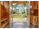 Mudroom looking onto the backyard with play structure, landscaping, and outdoor seating area at 177 Ridgeland Ave, Decatur, GA 30030