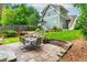 Backyard featuring a stone patio with seating and a playset at 177 Ridgeland Ave, Decatur, GA 30030