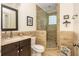 This bathroom features a glass door shower, tile walls, and a modern vanity, all contribute to a luxurious feel at 177 Ridgeland Ave, Decatur, GA 30030