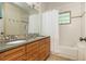 Well-lit bathroom with a double vanity, white subway tile, and modern fixtures, creating a clean and functional space at 177 Ridgeland Ave, Decatur, GA 30030