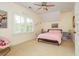 Bright bedroom features large windows, ceiling fan, and charming decor at 177 Ridgeland Ave, Decatur, GA 30030