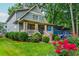 Beautifully landscaped front yard with vibrant roses and a charming view of the home's exterior at 177 Ridgeland Ave, Decatur, GA 30030