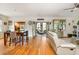 Spacious living room with hardwood floors, white trim, and access to the sunroom and dining area at 177 Ridgeland Ave, Decatur, GA 30030