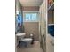Cozy bathroom features a sink, toilet, and shower with decorative curtain, and built in shelves at 3027 Vista Brook Dr, Decatur, GA 30033