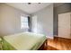 Comfortable bedroom with hardwood floors, natural light, and neutral paint scheme at 3027 Vista Brook Dr, Decatur, GA 30033
