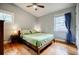 Comfortable bedroom with hardwood floors, two windows, ceiling fan and a well-made bed at 3027 Vista Brook Dr, Decatur, GA 30033