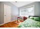 Bright bedroom features hardwood floors, large window, and modern decor at 3027 Vista Brook Dr, Decatur, GA 30033