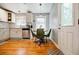 Bright kitchen with white cabinets, stainless steel appliances, and a cozy dining area at 3027 Vista Brook Dr, Decatur, GA 30033