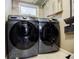 Laundry room with modern front load washer and dryer set at 3027 Vista Brook Dr, Decatur, GA 30033