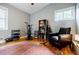 Comfortable living room features hardwood floors, a cozy chair, and a bookshelf at 3027 Vista Brook Dr, Decatur, GA 30033