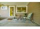 Charming porch featuring a cozy seating area with a vintage chair and a rug at 3027 Vista Brook Dr, Decatur, GA 30033